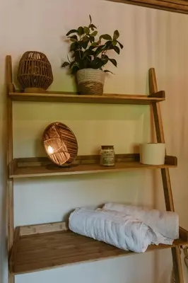 a shelf with a towel and a plant on it at hotel nativo san blas in Playa San Blas