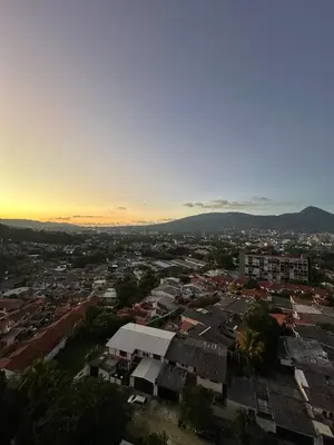 an aerial view of a city at sunset at NU Lomas Garden in Antiguo Cuscatlán