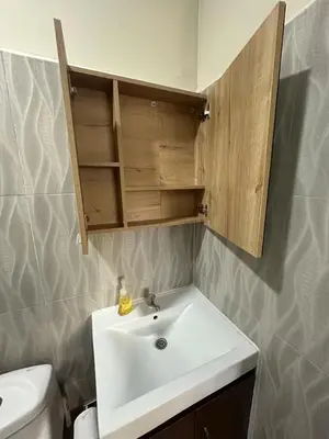 a bathroom with a white sink and a toilet at Pool • Resort Access • Game Room • Fire Pit in Los Cóbanos
