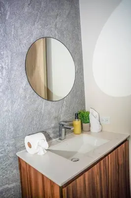 a bathroom with a sink and a mirror at San Blas Loft in Playa San Blas