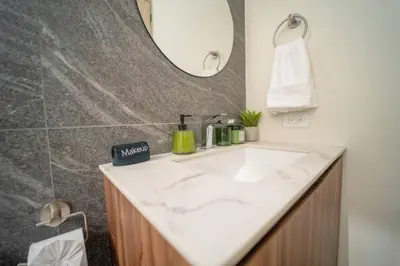 a bathroom with a white sink and a mirror at San Blas Loft in Playa San Blas