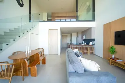 a living room with a couch and a table at San Blas Loft in Playa San Blas