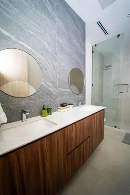 a bathroom with a sink and a glass shower at San Blas Loft in Playa San Blas