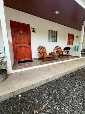 two chairs sitting on the porch of a house at Sunzal Tropical 9 in Tamanique