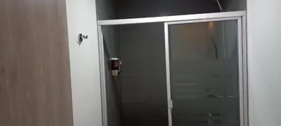 a shower with a glass door in a bathroom at Apto 52 Lomas in Antiguo Cuscatlán