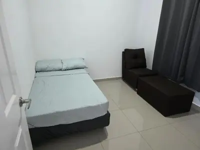 a small bedroom with a bed and a chair at Casa Nueva San Miguel in San Miguel