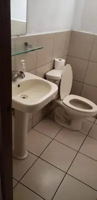 a bathroom with a toilet and a sink at Casablanca in San Salvador