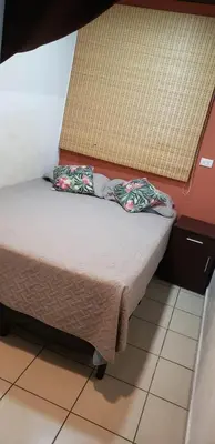 a small bed with two pillows in a room at Casablanca in San Salvador