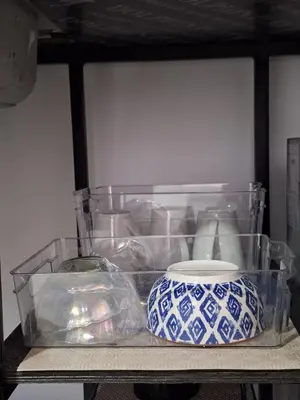 a shelf with a clear container and a blue and white vase at Villa Sunzal Surf Retreat' in La Libertad