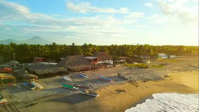 an aerial view of a beach with boats on the sand at Beachfront Hotel near International Airport in Las Hojas