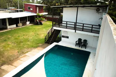 an aerial view of a house with a swimming pool at Beachfront Hotel near International Airport in Las Hojas