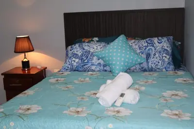 a bed with two rolls of toilet paper on it at Costabay in El Zapote