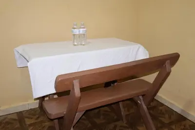 a table with two bottles of water on top of it at habitacion costabay in San Luis La Herradura