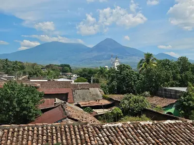 a view of a village with mountains in the background at El hostal de Uriel in Izalco