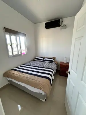a bedroom with a bed in a room with a window at Casa de las villas 3 in San Miguel