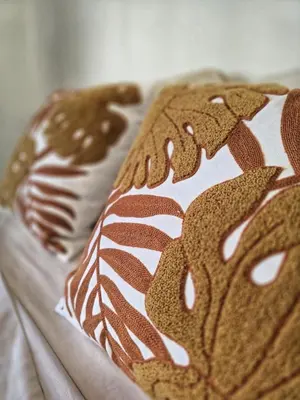 a close up of a brown and white pillow at 4 Amigos El Zonte in ChiltiupÃ¡n