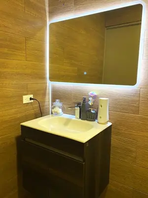 a bathroom with a sink and a mirror at Cozy house 5 minutes from the airport in Las Flores