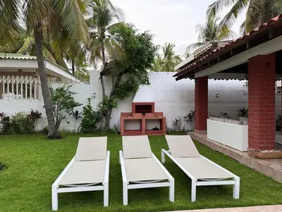 two white chairs and a table in a yard at Casa Marea - Costa del Sol in Marcelino
