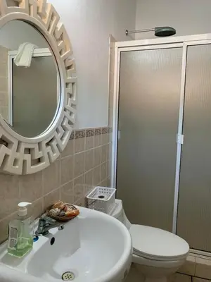a bathroom with a sink and a toilet and a mirror at Casa Marea - Costa del Sol in Marcelino
