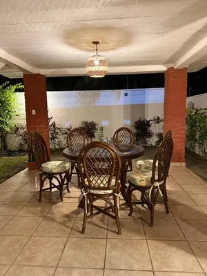 a table and chairs and a chandelier on a patio at Casa Marea - Costa del Sol in Marcelino