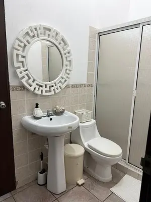 a bathroom with a toilet and a sink and a mirror at Casa Marea - Costa del Sol in Marcelino