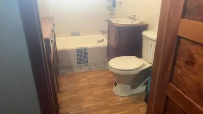a bathroom with a toilet and a sink at Ahuachapán Getaway