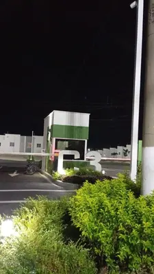 a gas station at night with a building at Joseline House in San Miguel