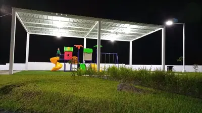 a person is playing on a playground at night at Joseline House in San Miguel