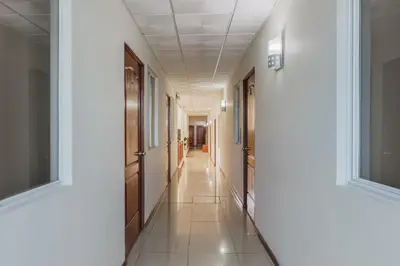 a hallway of a hospital with white walls and ceilings at Hotel Windsor Plaza in San Salvador