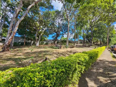 a path in a park with trees and a sidewalk at Apto en Santa Ana con AC in Santa Ana