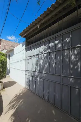 a metal garage door on a house at Apto en Santa Ana con AC in Santa Ana