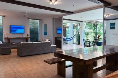 a living room with a table and a couch at Casa Cielo in La Libertad