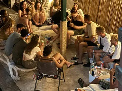 a group of people sitting in a room at Dos Palmas in El Sunzal