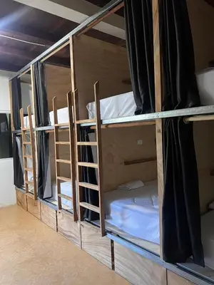 two bunk beds with their doors open in a room at Dos Palmas in El Sunzal