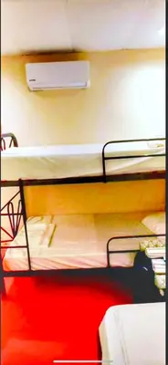a group of bunk beds in a room at Sea Garden Mizata in Las Piedras