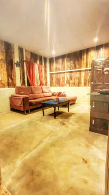 a living room with a couch and a table at Sea Garden Mizata in Las Piedras