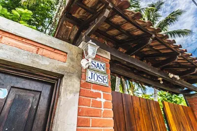 a sign on the side of a house that says san just at Rancho San Jose - Barra De Santiago in Barra de Santiago