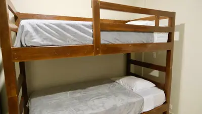 a couple of bunk beds in a room at Casa Origen El Zonte in El Zonte