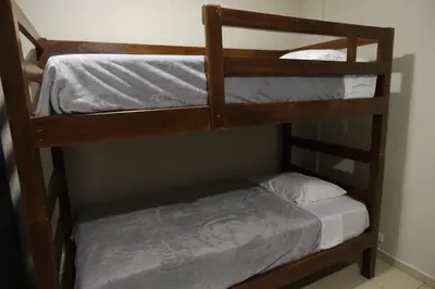 a couple of bunk beds in a room at Casa Origen El Zonte in El Zonte
