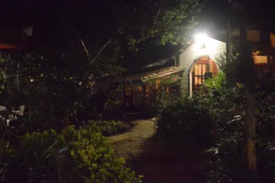a house with a light on top of it at night at Hostal y Restaurante Chilltepe Ataco in Concepción de Ataco