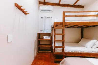 a room with bunk beds in a hostel at Punta Mango Villas in La Periquera