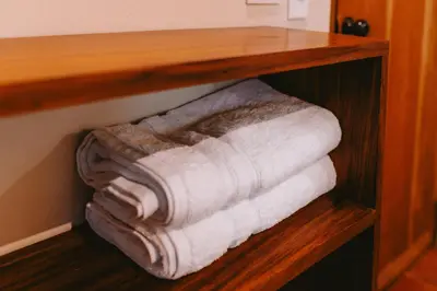 a bunch of towels are stacked on a shelf at Punta Mango Villas in La Periquera