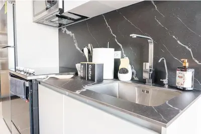 a kitchen counter with a sink in a kitchen at Spacious 2BR 2BTH El Zonte with oceanview and pool in El Zonte