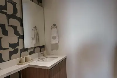 a bathroom with a sink and a mirror at Spacious 2BR 2BTH El Zonte with oceanview and pool in El Zonte