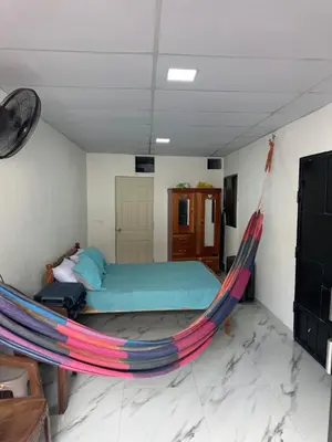 a bedroom with a bed and a hammock at The Best Place for You to Relax