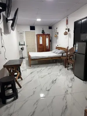 a bedroom with a bed and a table and chairs at The Best Place for You to Relax