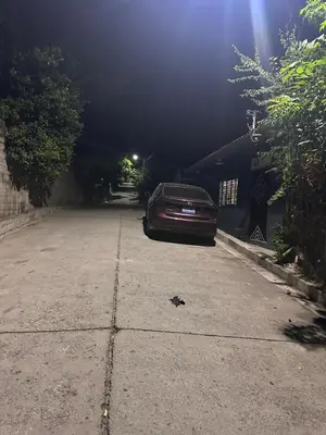 a car parked in a parking lot at night at The Best Place for You to Relax