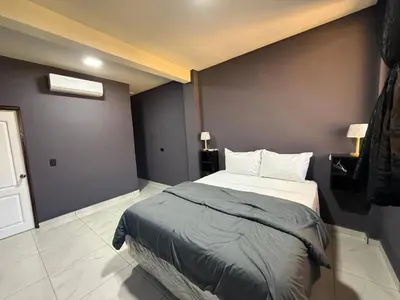 a bedroom with a large bed in a room at Bella Habitación El Mangal B&B in Suchitoto