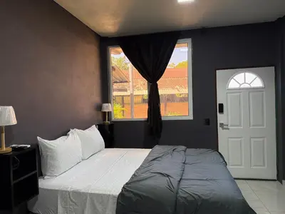 a bedroom with a large bed and a window at Bella Habitación El Mangal B&B in Suchitoto