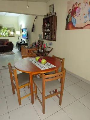 a wooden table with two balls on it in a living room at La Joyona, Cozy House, Atiquizaya